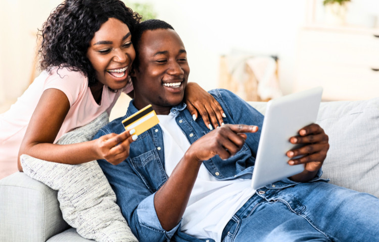 A couple enjoying shopping online together